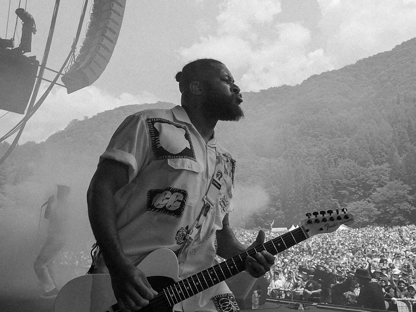 Black and white photo of Brandon Davis, guitarist of Fever 333, performing live, photo by Felix Dickinson of Studio AAA